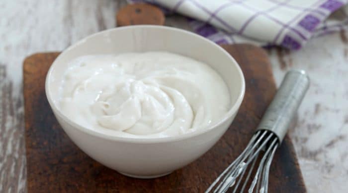 a bowl of plain vegan sour cream